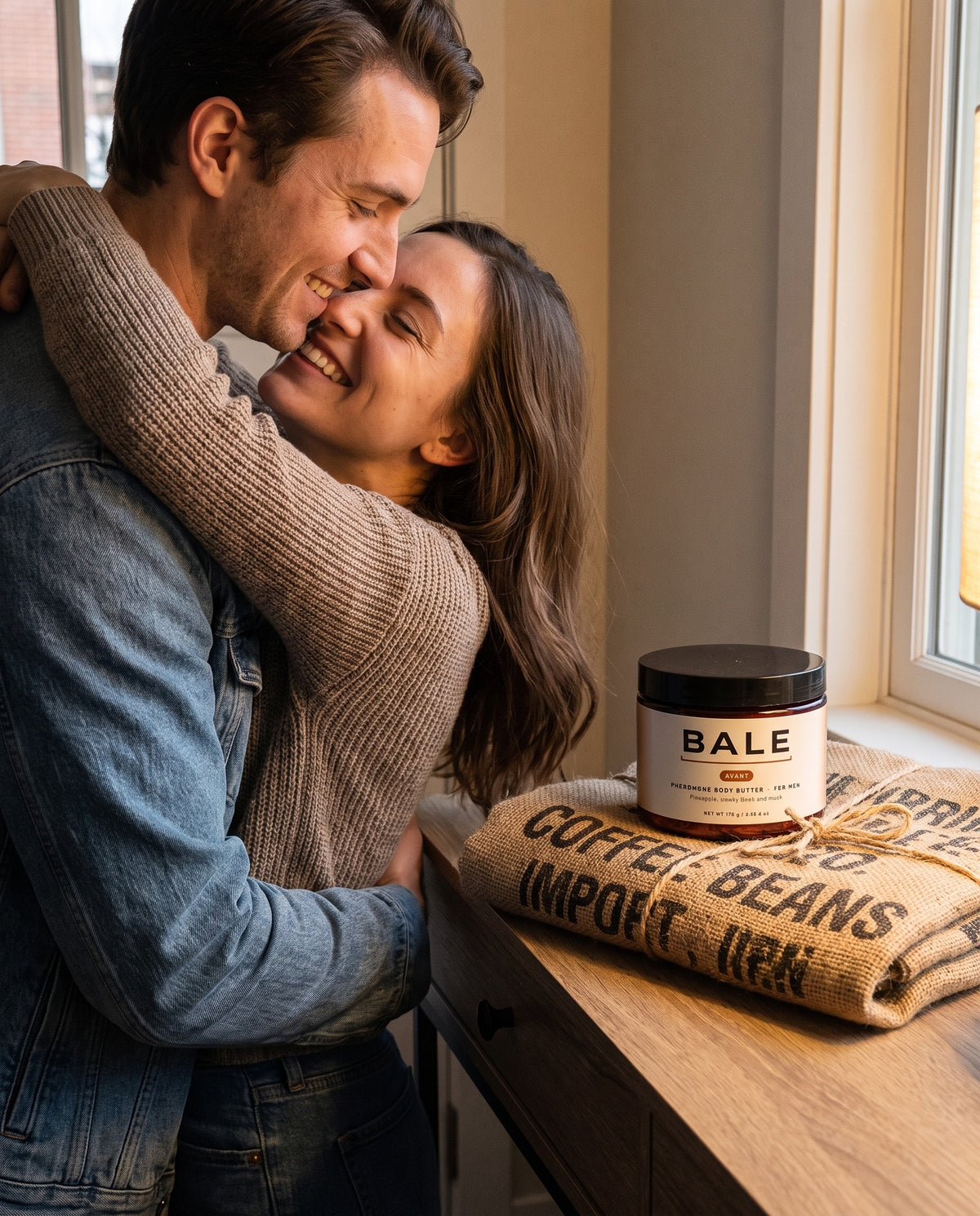 She leans in close to him, the Avant jar on the console table